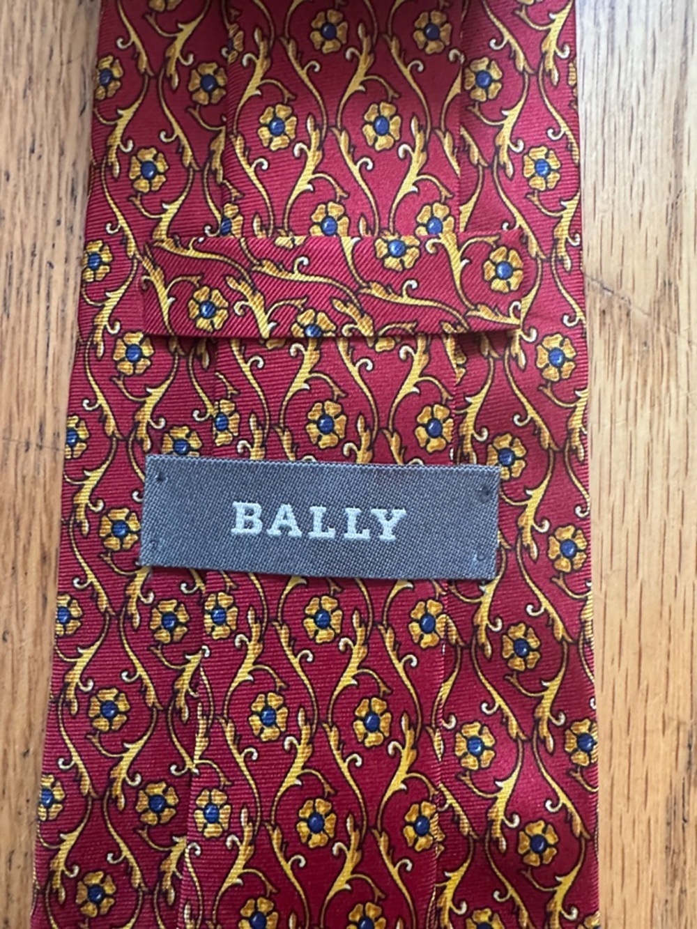 Bally Burgundy Silk Tie with Gold and Blue Floral Motif